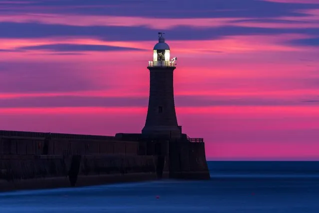 A spectacular sunrise this morning, September 22, 2022 dominates skies over Tynemouth Pier and South Shields Pier, England. It's been reported snow could fall in some areas of the UK as temperatures continue to drop into the Autumn, according to the Met Office. (Photo by John Fatkin/Cover Images)