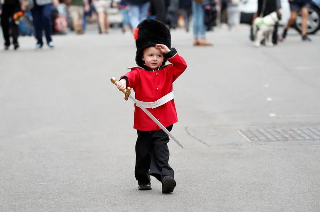 Bruce Pollard, 3, wearing a guardsman's costume, walks in Windsor following the death of Britain's Queen Elizabeth, in Britain, September 13, 2022. (Photo by Peter Nicholls/Reuters)