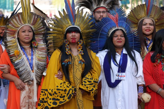 Representatives of indigenous groups from Brazil march through the conference venue on day six of the UNFCCC COP28 Climate Conference at Expo City Dubai on December 05, 2023 in Dubai, United Arab Emirates. The COP28, which is running from November 30 through December 12, is bringing together stakeholders, including international heads of state and other leaders, scientists, environmentalists, indigenous peoples representatives, activists and others to discuss and agree on the implementation of global measures towards mitigating the effects of climate change. (Photo by Sean Gallup/Getty Images)