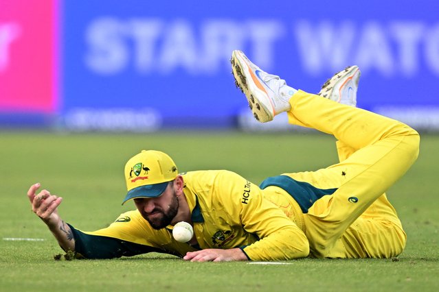 Australia's Matthew Short drops a catch to dismiss Afghanistan's Azmatullah Omarzai during the ICC Champions Trophy one-day international (ODI) cricket match between Australia and Afghanistan at the Gaddafi Stadium in Lahore on February 28, 2025. (Photo by Aamir Qureshi/AFP Photo)