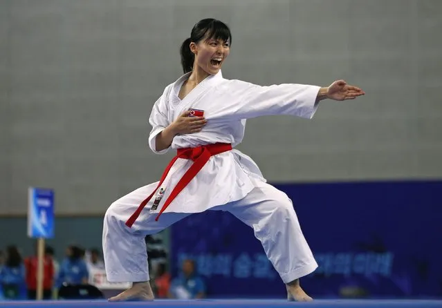 North Korea's Kang Ji Ui competes against Nepal's Bimala Tamang in the women's kata bronze medal contest of the karate competition at Gyeyang Gymnasium during the 17th Asian Games in Incheon October 2, 2014. (Photo by Jason Reed/Reuters)