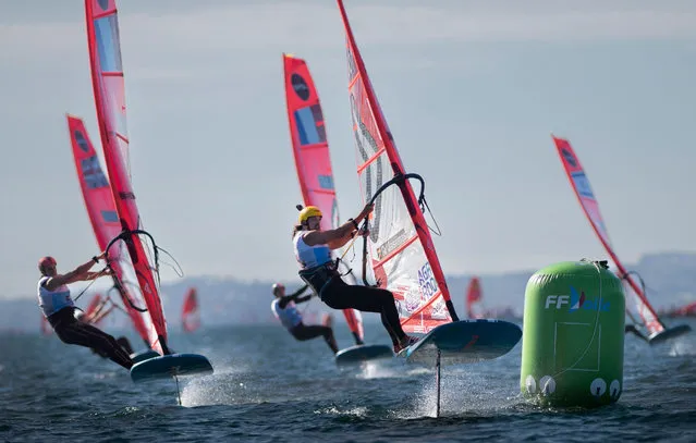 This photograph taken on October 20, 2022, shows competitors sailing during the IQFoil World Championships in Brest, western France. Designated an olympic discipline in 2019, IQFoil will make its appearance for the first time in the program of the Paris 2024 Olympic Games. (Photo by Fred Tanneau/AFP Photo)