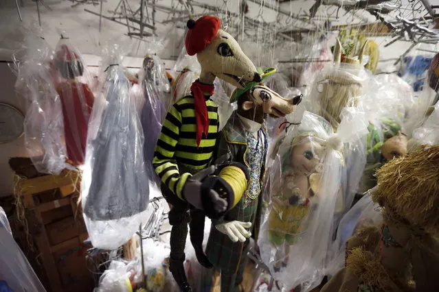 Marionettes hang in a storage area at the Bob Baker Marionette Theater in Los Angeles, California October 17, 2014. (Photo by Lucy Nicholson/Reuters)