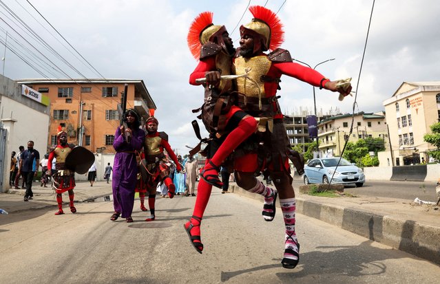 Members of St. Dominic Catholic Church take part in a re-enactment of the crucifixion of Jesus Christ, on Good Friday in Yaba, Lagos, Nigeria, on April 18, 2025. (Photo by Sodiq Adelakun/Reuters)