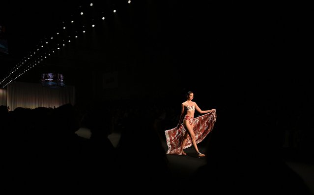 A model presents a creation by Palmacea brand during Bogota Fashion Week in Bogota on May 22, 2025. (Photo by Luis Acosta/AFP Photo)