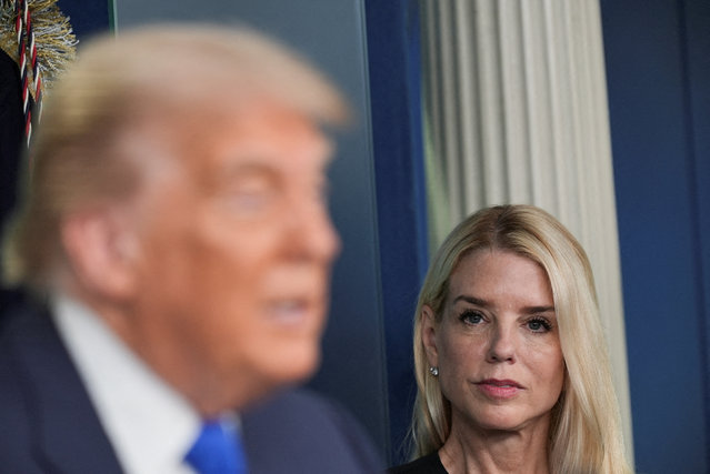 U.S. Attorney General Pam Bondi listens as President Donald Trump speaks to the media, after the U.S. Supreme Court dealt a blow to the power of federal judges by restricting their ability to grant broad legal relief in cases as the justices acted in a legal fight over President Donald Trump's bid to limit birthright citizenship, in the Press Briefing Room at the White House in Washington D.C., on June 27, 2025. (Photo by Ken Cedeno/Reuters)