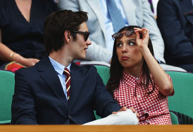 Singer Olivia Rodrigo with her partner and actor Louis Partridge in the Royal Box on Centre Court during the second round match between Spain's Carlos Alcaraz and Britain's Oliver Tarvet at All England Lawn Tennis and Croquet Club in London, Britain on July 2, 2025. (Photo by Isabel Infantes/Reuters)
