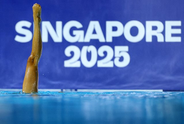 Italy's Enrica Piccoli and Lucrezia Ruggiero perform during the women duet technical preliminaries during the Singapore 2025 World Aquatics Championships at World Aquatics Championships Arena on July 18, 2025 in Singapore. (Photo by Hollie Adams/Reuters)