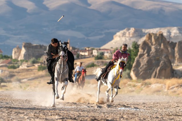 People ride horse at Cappadocia, which held a special place for horses throughout history, in Nevsehir, Turkiye on June 29, 2025. Visitors to the region can join guided horseback tours held in the wide valleys, especially during morning and evening hours. Located within the borders of Nevehir, Cappadocia stands out not only for its natural formations but also for its rich cultural heritage. (Photo by Ayten Altintas/Anadolu via Getty Images)