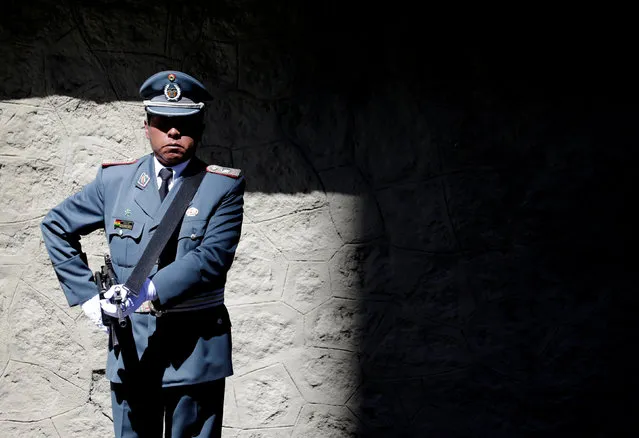 A military officer stands guard during the Sea Day commemorations at the Eduardo Avaroa square in La Paz, Bolivia March 23, 2018. (Photo by David Mercado/Reuters)