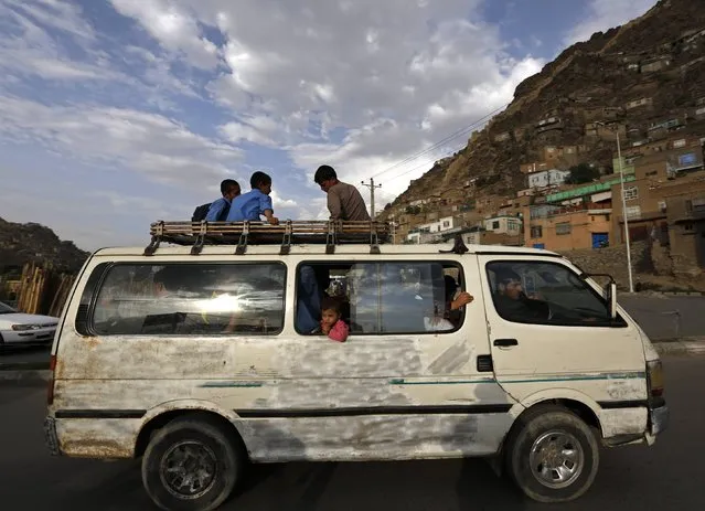 People travel in an overcrowded van in Kabul August 31, 2014. (Photo by Mohammad Ismail/Reuters)