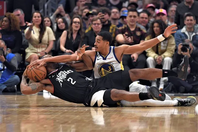 Kawhi Leonard #2 of the Los Angeles Clippers battles for the ball with Jordan Poole #3 of the Golden State Warriors during the first half of the game at Crypto.com Arena on March 15, 2023 in Los Angeles, California. (Photo by Kevork Djansezian/Getty Images)