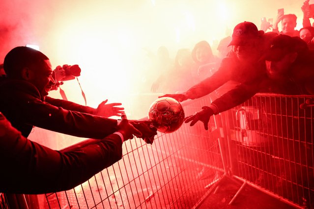 Paris Saint-Germain's French forward Ousmane Dembele celebrates with supporters after receiving the Ballon d'Or award at the end of the 2025 Ballon d'Or France Football award ceremony outside the Theatre du Chatelet in Paris on September 22, 2025. (Photo by Franck Fife/AFP Photo)