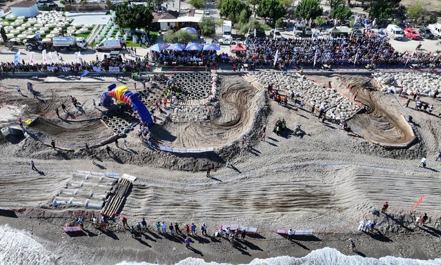 An aerial view of the beach as riders compete during the 16th Sea to Sky Enduro Motorcycle Race, the fifth round of the Hard Enduro World Championship, in Kemer district of Antalya, Turkiye, on October 10, 2025. The international event, included in the championship by the FIM, hosts nearly 400 athletes from around 40 countries. (Photo by Orhan Cicek/Anadolu via Getty Images)
