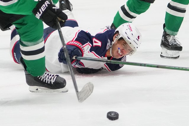 Columbus Blue Jackets center Cole Sillinger falls while attacking the Dallas Stars’ zone during an NHL hockey game on Tuesday, October 21, 2025. (Photo by Julio Cortez/AP  Photo)