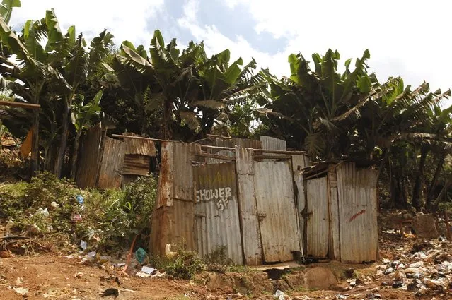 A public toilet made of rusty sheets of metal stands in Gatwekera village in Kibera slum in Nairobi, Kenya, October 12, 2015. (Photo by Thomas Mukoya/Reuters)