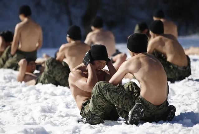 Shirtless members of the South Korean Special Warfare Forces take part in a winter exercise in Pyeongchang January 8, 2015. (Photo by Kim Hong-Ji/Reuters)