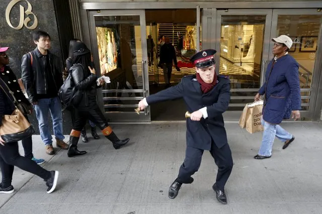 Salvation Army Bell Ringer Nate Hinzman dances for Black Friday shoppers outside Bloomingdales department in the Manhattan borough of New York, November 27, 2015. (Photo by Brendan McDermid/Reuters)