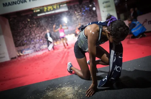 Mamitu Daska Molisa from Ethiopia  reacts after winning the women's race of the 2016 Frankfurt Marathon in Frankfurt, Germany, 30 October 2016. (Photo by Christoph Schmidt/EPA)