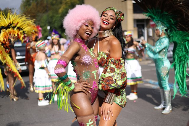 Samba dancers pose for a photo ahead of the Notting Hill Carnival parade, in London, Britain on August 26, 2024. (Photo by Hollie Adams/Reuters)