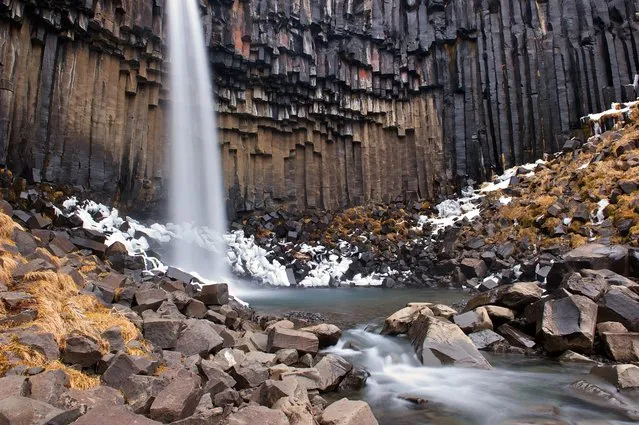 “Svartifoss (The Black Fall)”. Svartifoss (The Black Fall) is surrounded by dark lava columns, which give rise to its name. The hexagonal columns were formed inside a lava flow which cooled extremely slowly, giving rise to crystallization. Location: Skaftafell National Park, Iceland. (Photo and caption by Giacomo Ciangottini/National Geographic Traveler Photo Contest)
