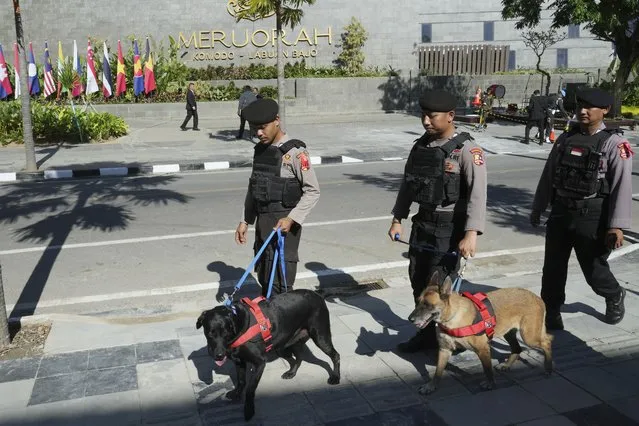 Indonesian police K9 patrol in front of Meruorah hotel in Labuan Bajo, East Nusa Tenggara province, Indonesia, Monday, May 8, 2023. Indonesian President Joko Widodo will host fellow leaders of the Association of Southeast Asian Nations this week in their annual summit in Labuan Bajo. (Photo by Achmad Ibrahim/AP Photo)