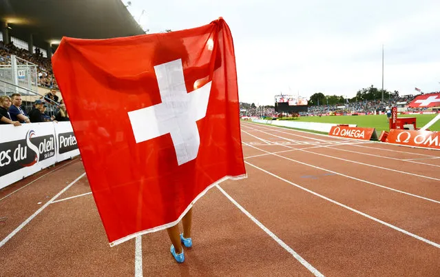 Switzerland's Mujinga Kambundji celebrates after winning the women' s 4x100 m UBS Trophy relay race, at the Athletissima IAAF Diamond League international athletics meeting in the Stade Olympique de la Pontaise in Lausanne, Switzerland, Thursday, July 5, 2018. (Photo by Denis Balibouse/Reuters)