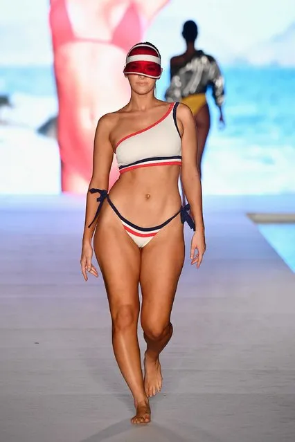 A model walks the runway wearing a patriotic-style sporty bikini set and visor for the 2018 Sports Illustrated swimsuit show during Miami Swim Week at the W South Beach hotel on July 15, 2018. (Photo by Alexander Tamargo/Getty Images for Sports Illustrated)