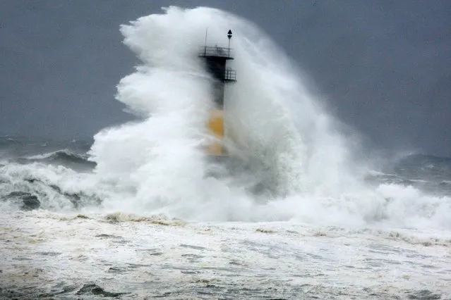 High wave hits a lighthouse as typhoon Neoguri approaches the Korean Peninsula in Seogwipo on Jeju Island , South Korea, Wednesday, July 9, 2014. (Photo by Ko Sung-sik/AP Photo/Yonhap)