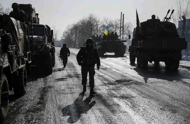 Members of the Ukrainian armed forces are seen near Debaltseve, eastern Ukraine, February 12, 2015. (Photo by Gleb Garanich/Reuters)