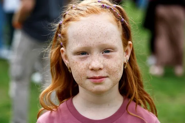 Cathaleyna, 7, from Nijmegen, poses as she attends the annual Redhead Days Festival in Tilburg, Netherlands on August 27, 2023. (Photo by Piroschka van de Wouw/Reuters)