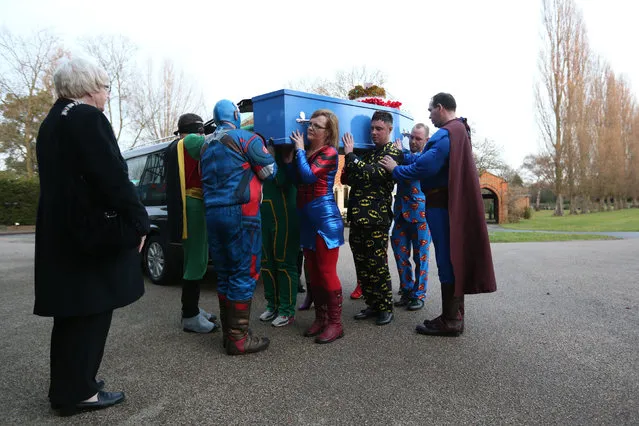 Pallbearers dressed as superheroes carry the coffin of 18-year-old Arthur Peebles in Morden, England on December 9, 2016. A tragic teenage comic book fan who killed himself after being bullied was given a fitting send off with a superhero-themed funeral. Mourners donned capes, masks and plastic props in a heartfelt final tribute to Arthur Peeble who died on November 1 after years of bullying and mental health problems. (Photo by Jonathan Brady/PA Wire)