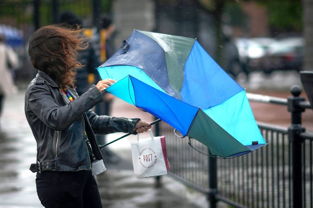 People brave the first rain and wind of Storm Agnes as it approaches the UK on September 27, 2023 in Liverpool, United Kingdom. (Photo by Christopher Furlong/Getty Images)