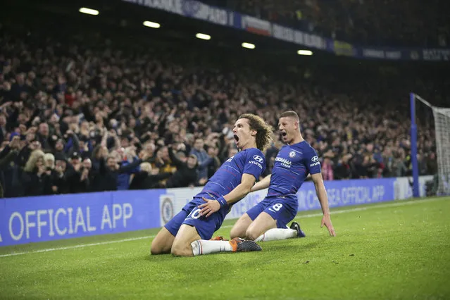 Chelsea's David Luiz, left, celebrates after scoring his side's opening goal during the English Premier League soccer match between Chelsea and Manchester City at Stamford Bridge in London, Saturday December 8, 2018. (Photo by Tim Ireland/AP Photo)