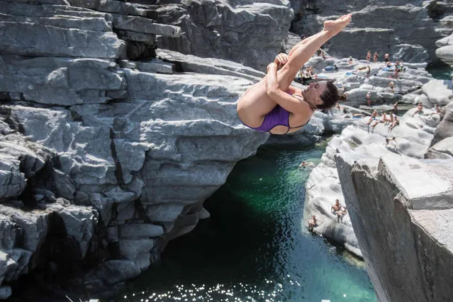 Celia Fernandez from Spain jumps at the qualification to the International Cliff Diving championship in Ponte Brola, Switzerland into the Maggia river, Friday, July 23 2021. (Photo by Samuel Golay/Keystone via AP Photo)
