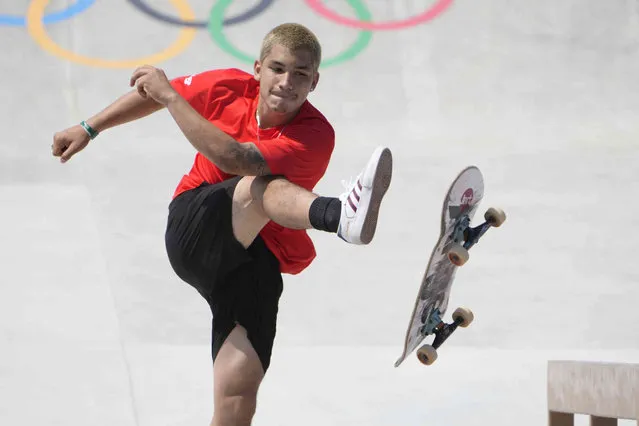 Angelo Caro Narvaez of Peru kicks his board after his final attempt during the men's street skateboarding finals at the 2020 Summer Olympics, Sunday, July 25, 2021, in Tokyo, Japan. (Photo by Jae C. Hong/AP Photo)
