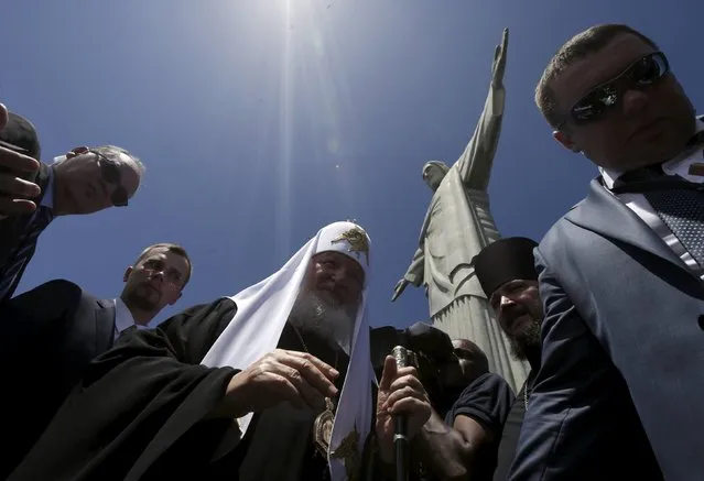 Russian Orthodox Patriarch Kirill walks after attending a mass in front of the Christ the Redeemer statue, in Rio de Janeiro, Brazil, February 20, 2016. (Photo by Ricardo Moraes/Reuters)