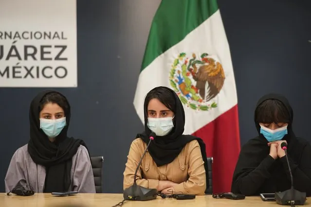 Several of the original members of the Afghan all-girls robotics team, who have received threats from the Taliban, attend a press conference after arriving at the Benito Juarez International Airport in Mexico City, Tuesday, August 24, 2021. After extensive international efforts and coordination from a diverse group of volunteers to evacuate the team, the girls are now begging the international community to help get their family to safety with them. (Photo by Eduardo Verdugo/AP Photo)