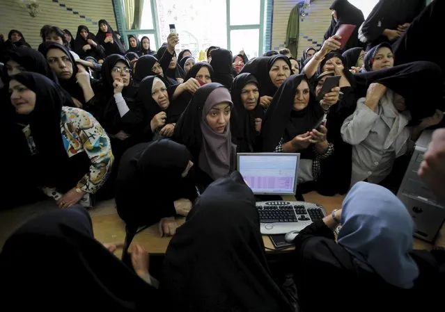 Iranian women wait to cast their votes during the Iranian presidential election in Tehran, in this June 12, 2009 file photo. (Photo by Ahmed Jadallah/Reuters)