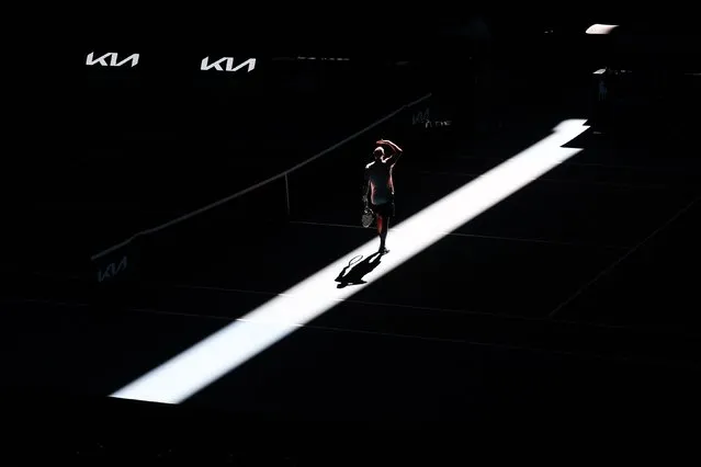 France's Adrian Mannarino looks up at the roof closing on Rod Laver Arena during a practice session in Melbourne on January 11, 2024 ahead of the Australian Open tennis championship starting on January 14. (Photo by David Gray/AFP Photo)
