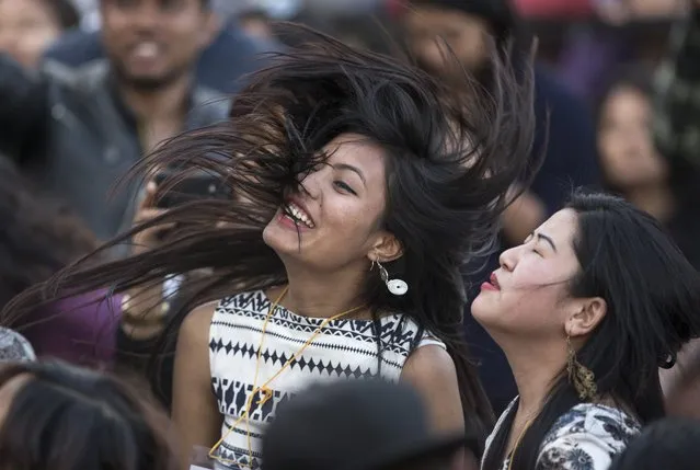 Nepalese young girls cheer and dance during in a concert to mark International Women's Day in Kathmandu, Nepal, 08 March 2016. International Women's Day is globally observed on 08 March, in order to highlight the struggles of women across the globe and promote women's rights. (Photo by Narendra Shrestha/EPA)