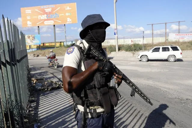 A National Police officer patrols an intersection in Port-au-Prince, Haiti, Friday, January 26, 2024. (Photo by Odelyn Joseph/AP Photo)
