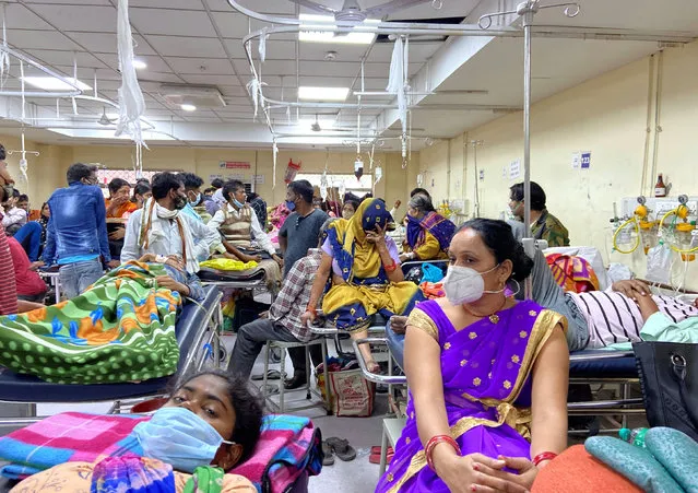 People are seen on stretchers at an emergency ward of a government hospital as dengue cases in the city cross the 1000-mark, in New Delhi, India, October 26, 2021. (Photo by Anushree Fadnavis/Reuters)