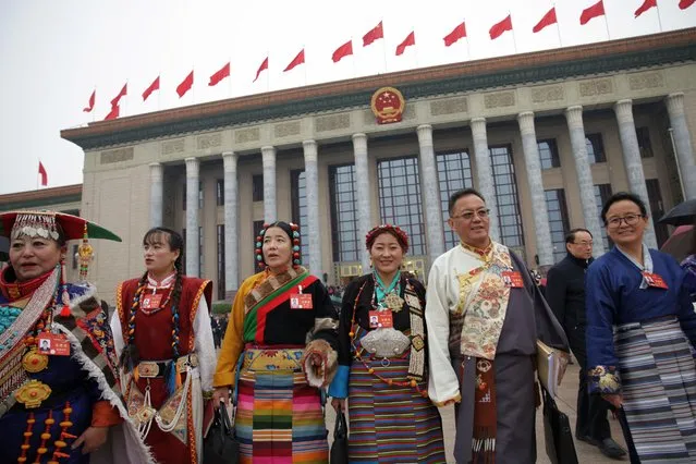 Chinese ethnic minority delegates leave the Great Hall of the People after the opening ceremony of the second session of the 14th National People's Congress of China in Beijing, China, 05 March 2024. China holds two major annual political meetings, the National People's Congress (NPC) and the Chinese People's Political Consultative Conference (CPPCC) which run alongside and together are known as “Lianghui” or “Two Sessions”. (Photo by Andres Martinez Casares/ EPA)