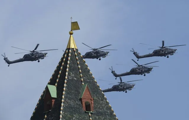 Russian Mil Mi-28N Havoc helicopters fly in formation over the Red Square during the Victory Day parade in Moscow, Russia, May 9, 2015. (Photo by Reuters/Host Photo Agency/RIA Novosti)