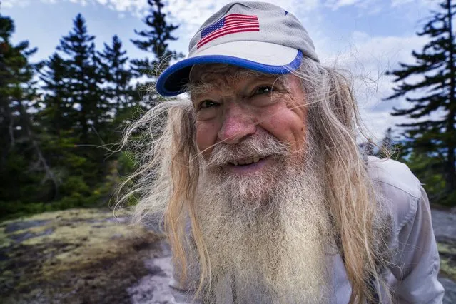 M.J. Eberhart, 83, arrives on the summit of Mount Hayes on the Appalachian Trail, Sunday, September 12, 2021, in Gorham, New Hampshire. Eberhart, who goes by the trail name of Nimblewill Nomad, is the oldest person to hike the entire 2,193-mile Appalachian Trail. (Photo by Robert F. Bukaty/AP Photo)