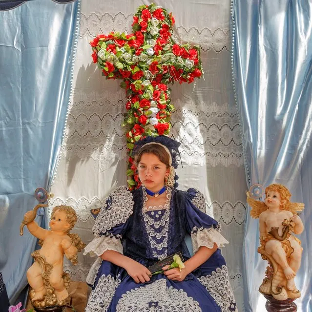 A “Maya” girl sits in an altar during the traditional celebration of “Las Mayas” on the streets in Madrid, Spain Sunday, May 10, 2015. (Photo by Daniel Ochoa de Olza/AP Photo)