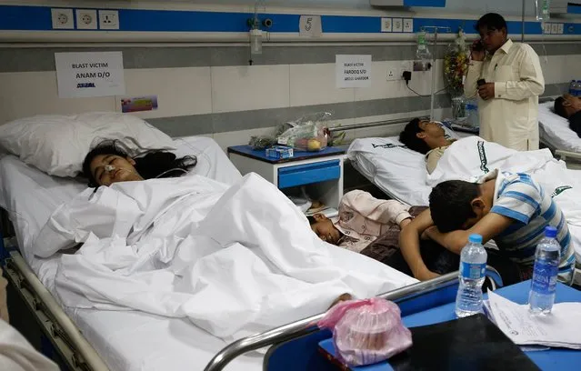 People who were injured in a suicide bomb attack receive medical treatment at a hospital in Lahore, Pakistan, 28 March 2016. At least 70 people, including women and children, were killed in a suicide bomb attack on 27 March that targeted a public park in Lahore. Some 340 people were reportedly injured in the attack claimed by a splinter group of the Pakistani Taliban. (Photo by Omer Saleem/EPA)