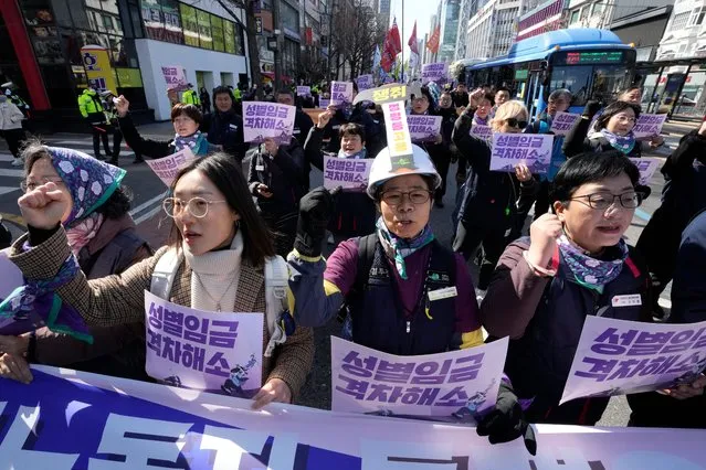 Members of the Korean Confederation of Trade Unions march during a rally marking International Women's Day in Seoul, South Korea, Friday, March 8, 2024. (Photo by Ahn Young-joon/AP Photo)