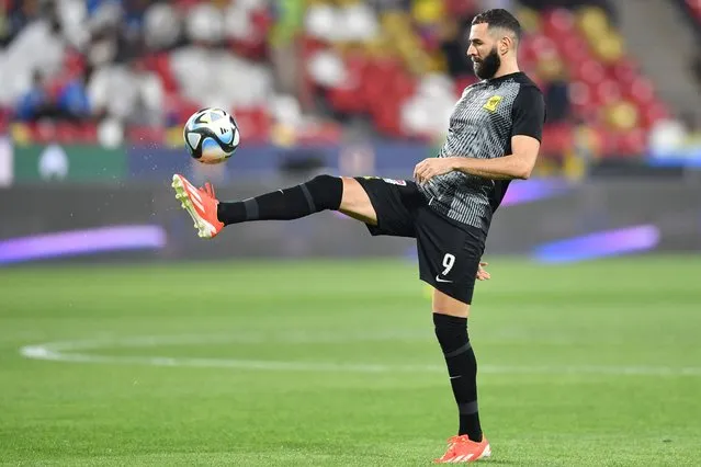 Ittihad's French forward #09 Karim Benzema warms up ahead of the Saudi Super Cup final football match between Al-Ittihad and Al-Hilal at the Mohammed bin Zayed Stadium in Abu Dhabi on April 11, 2024. (Photo by Ryan Lim/AFP Photo)
